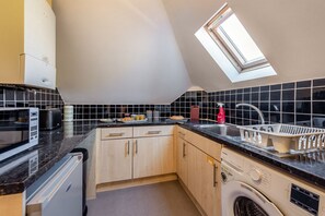 Fridge, microwave, oven, cookware/dishes/utensils