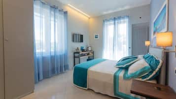 Deluxe Room, Balcony | In-room safe, blackout drapes, soundproofing, iron/ironing board