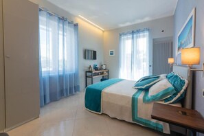 Deluxe Room, Balcony | 1 bedroom, in-room safe, blackout drapes, soundproofing