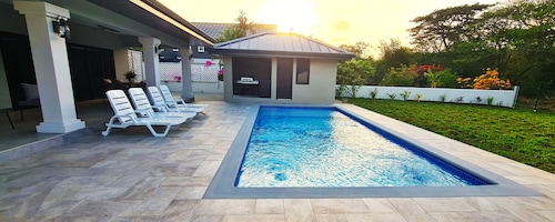 New spacious luxury 4-bedroom villa in gated development close to beaches.