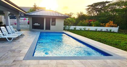 New spacious luxury 4-bedroom villa in gated development close to beaches.