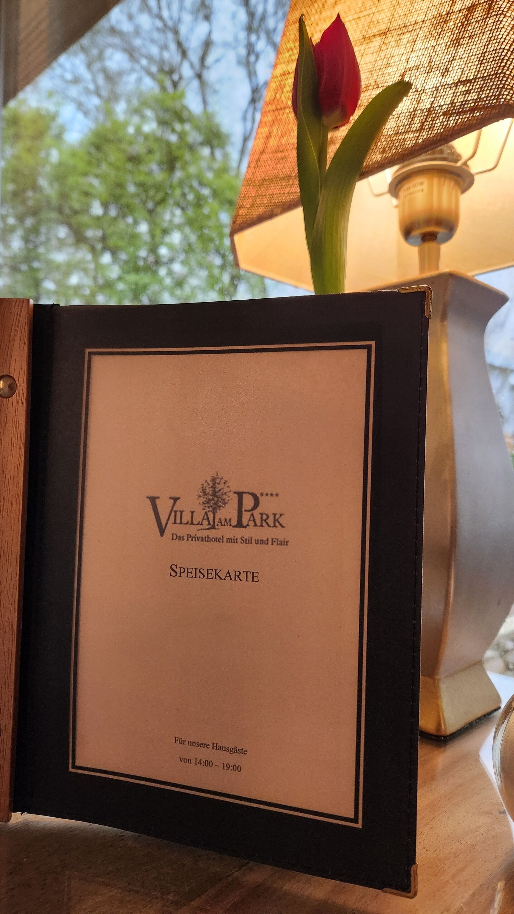A menu card for Villa Park, indicating it is a private hotel with a garden and lounge area.