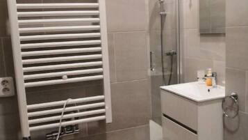 Shower, towels, soap, toilet paper