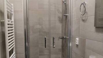 Shower, towels, soap, toilet paper