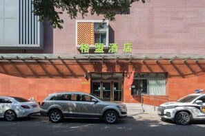 A building with a sign that reads 'Regent Hotel' and a parking area with several cars. - GreenTree Alliance (Beijing Temple of Heaven East Gate) (Beijing)