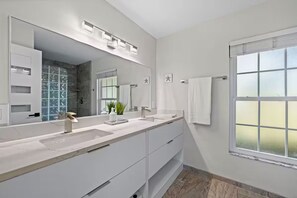 Shower, hair dryer, towels, toilet paper