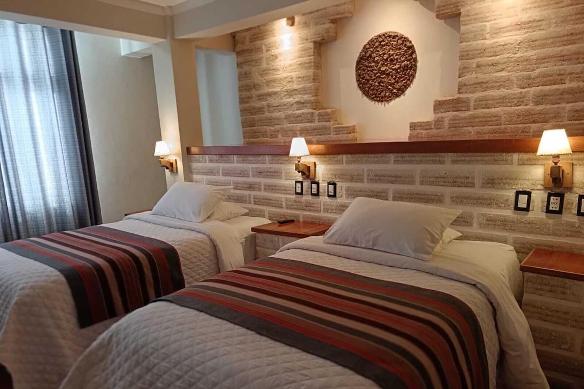 Deluxe Twin Room, City View | In-room safe, desk, laptop workspace, iron/ironing board