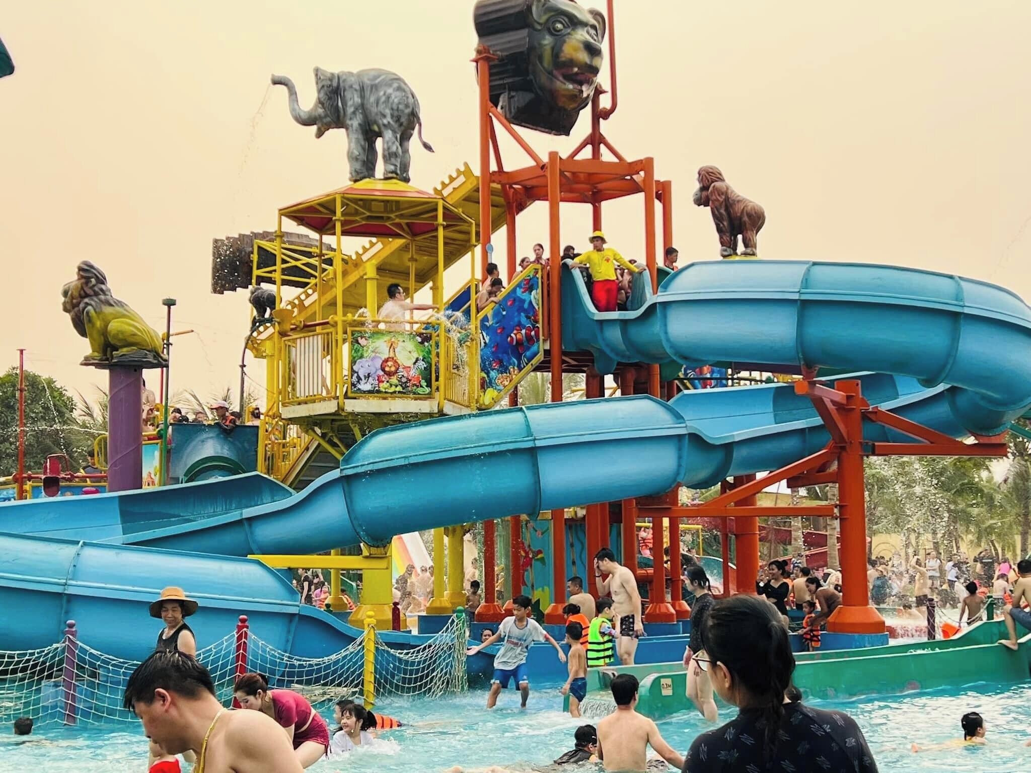 A water park with multiple slides and a large pool area.