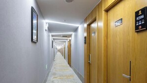 A hotel hallway with doors numbered 8206, 8205, and 8204. - Super 8 (Beijing West Gongyi Bridge) (Beijing)