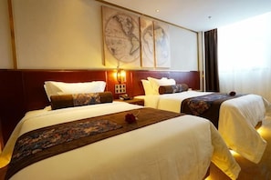 A hotel room with two beds, a large wall map, and a nightstand with a lamp. - James Joyce Coffetel (Beijing Yizhuang East Rongjing Street Metro Station) (Beijing)