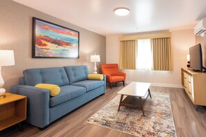 King Suite with Sofa Bed | Living area | 40-inch flat-screen TV with cable channels, stereo - Village Inn  (Lompoc)