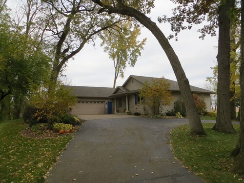 One bedroom and full bath in home 2 miles from EAA. Area with TV & refrigerator.