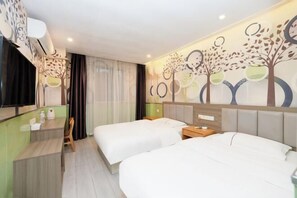 A hotel room with two beds, a desk, and a mirror. - Hongxing Business Hotel (Shanghai)