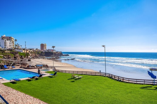 Dog-friendly oceanfront villa with pool access, rooftop patio, full kitchen