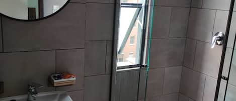 Shower, hair dryer, towels, soap