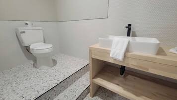Shower, hair dryer, towels, shampoo