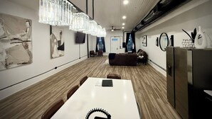 A modern interior with a dining area, a sofa, and artwork on the walls. - “Downtown Boro Loft” Charming 1600 sq foot open concept Downtown Jacksboro (Jacksboro)