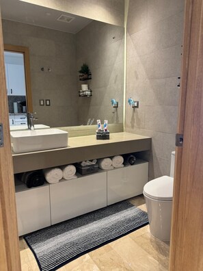 Shower, hair dryer, towels, soap