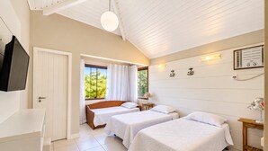 A hotel room with two beds, a TV, a window with curtains, a ceiling fan, and a wall-mounted heater. - Bz21 Casa com Jacuzzi e churrasqueira (Buzios)