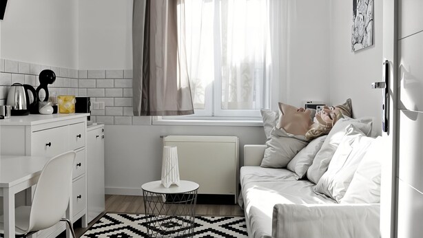 A compact, modern room with a kitchenette, a bed, and a window with curtains. - Cracow Route #4 - Old Town (Kraków)