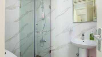 Shower, hair dryer, towels, shampoo