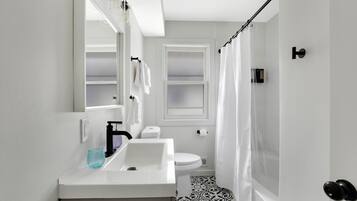 Hair dryer, towels, soap, shampoo