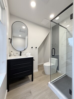 Shower, hair dryer, towels, soap