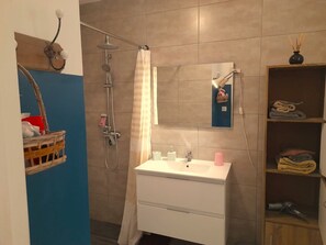 Shower, hair dryer, towels, soap