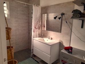 Shower, hair dryer, towels, soap
