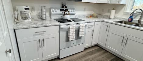 Fridge, microwave, stovetop, coffee/tea maker