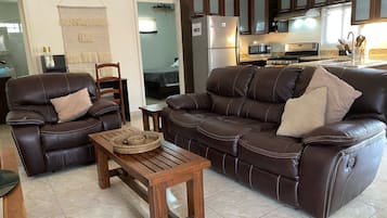 Deluxe Apartment, Patio, Pool View | Living area