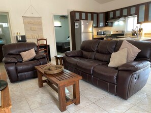 Deluxe Apartment, Patio, Pool View | Living area