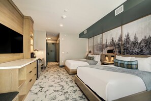 A hotel room with a bed, a desk, a mirror, and a large window with a forest view. - Kindred Resort a RockResort (Keystone)