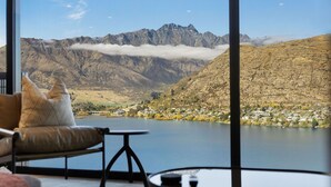 A room with a view of mountains and a lake. - The Bunker Charlie C (Queenstown)
