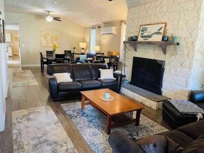 Smart TV, fireplace, books, computer monitors