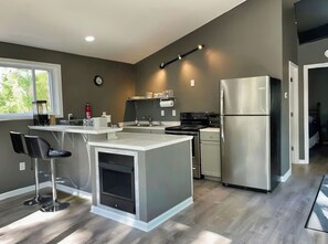 Fridge, microwave, stovetop, coffee/tea maker