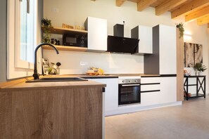 Fridge, dishwasher, electric kettle, cookware/dishes/utensils