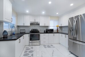 Fridge, microwave, oven, stovetop - Bright & Spacious 4BR Home | Private Backyard | Near Downtown Toronto (Ajax)