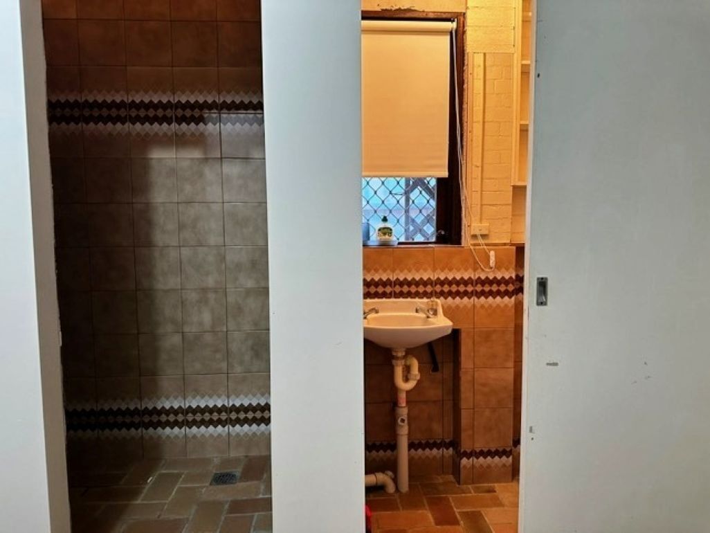 After a day at the beach rinse off in the shower at the bottom of the stairs. 