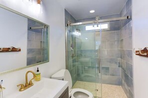 Shower, hair dryer, towels, toilet paper