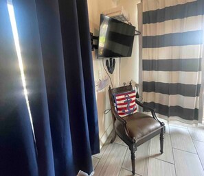 Exclusive Studio, 1 Queen Bed, Patio, Pool View | Living area | 50-inch Smart TV with digital channels