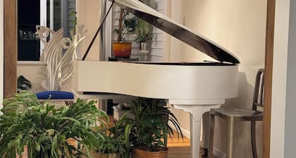 A sunlit & stylish 2-bedroom retreat with AC & complimentary Wi-Fi