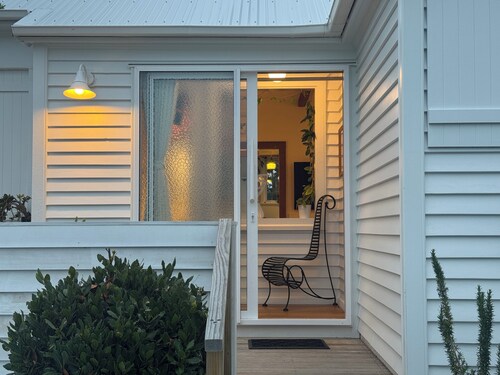 A sunlit & stylish 2-bedroom retreat with AC & complimentary Wi-Fi