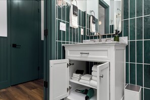 Shower, hair dryer, towels, soap