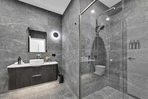 Shower, hair dryer, towels, shampoo