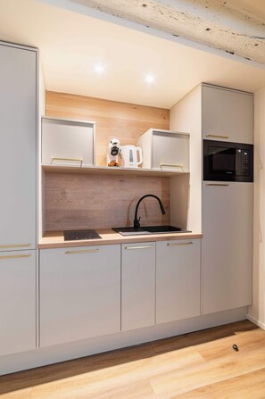 Fridge, microwave, stovetop, coffee/tea maker