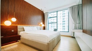 A modern bedroom with a large bed, wooden panel wall, and a large window with curtains. - Sunwah Pearl Suites  (Ho Chi Minh City)