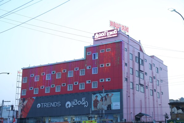 A multi-story building with a prominent sign reading "SRIPADAM GRAND" at the top. - SRIPADAM GRAND (Chilakaluripet)