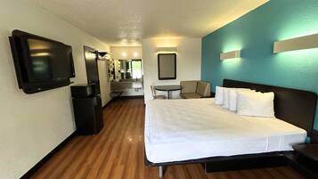 Deluxe Room, 1 King Bed, Non Smoking, Kitchenette | 1 bedroom, desk, free WiFi, bed sheets