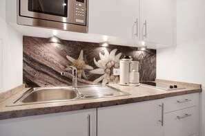 Fridge, microwave, stovetop, coffee/tea maker